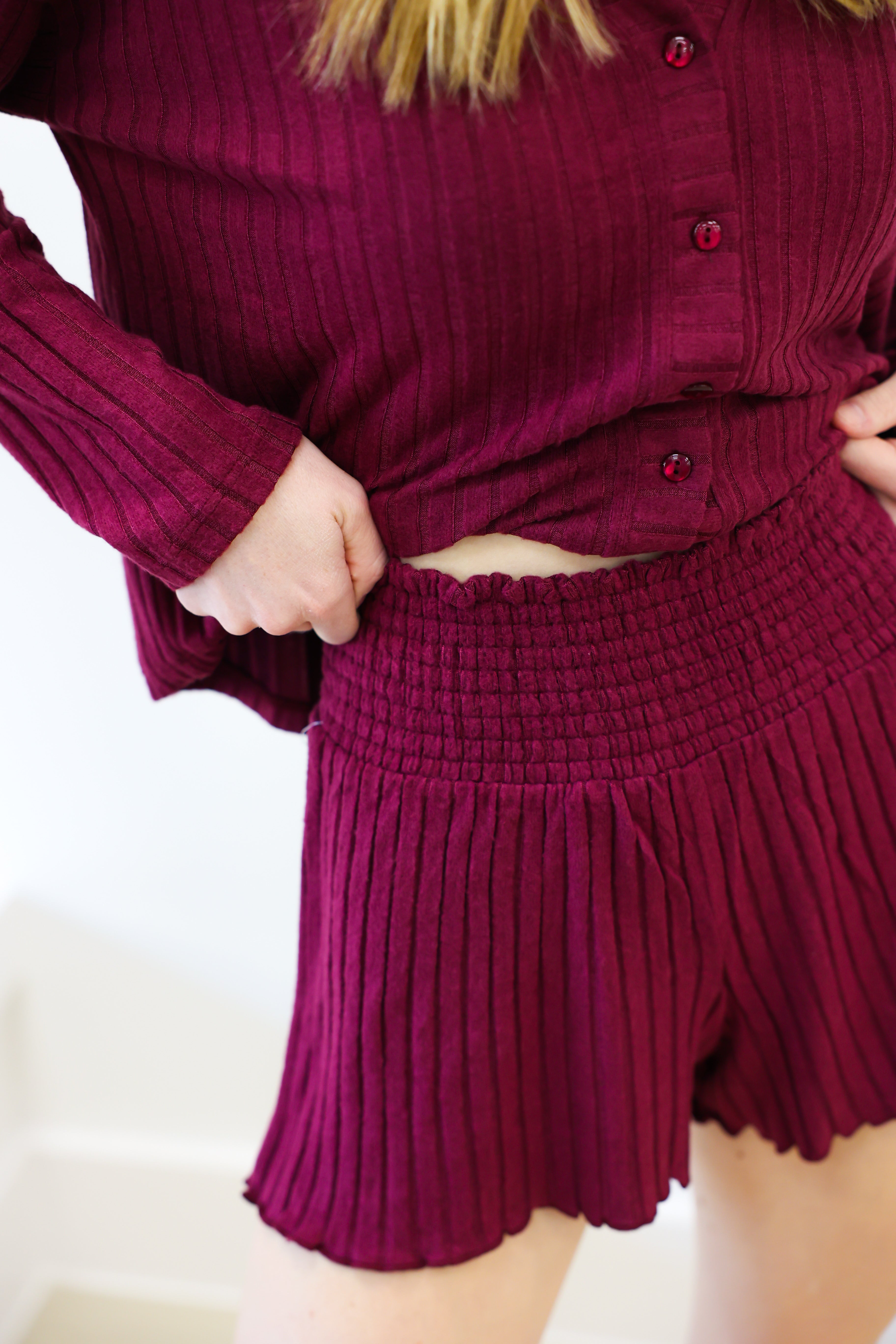 Maroon ribbed outfit with a top and shorts on a white background