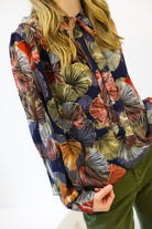 Colorful patterned shirt with a white background